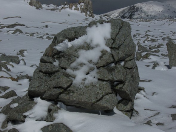 Snow on cracked rock