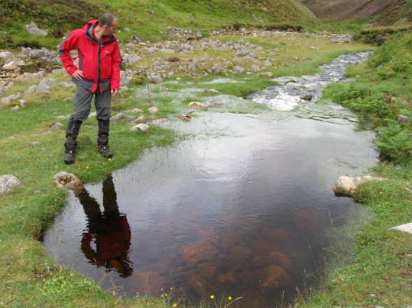 Water appearing as if from nowhere, and rushing down the glen