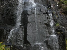 Waterfall flowing into River Leven