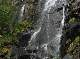 Waterfall flowing into River Leven