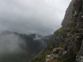 Walking carefully along the narrow ledge, or shelf