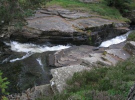 Water rushing through a narrow cleft in the rocks
