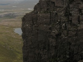 Loch Toll an Lochain beyond the rock cliffs