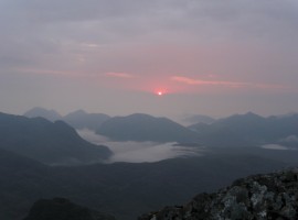 Sun emerging above the Red Cuillin