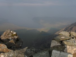 Shadow of ridgeline being cast towards the sea