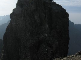 Silhouetted at the top of the In Pinn