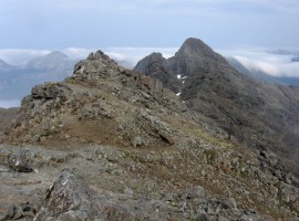 The Red Cuillin hills peeking over the shoulder of the ridge