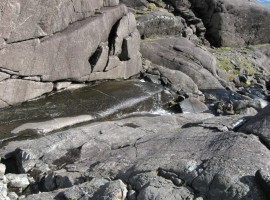 Allt Coir' a' Ghrunnda flowing from the loch down slabs